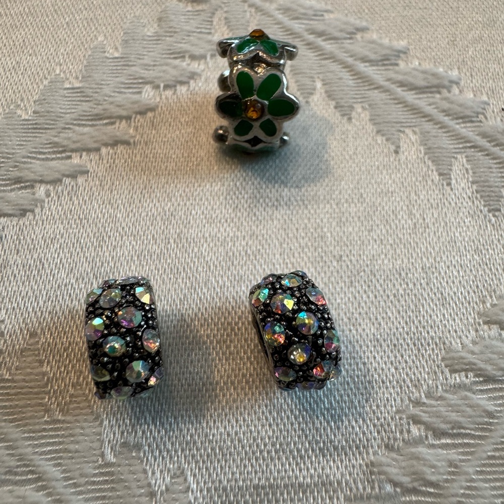 Three beads/charms for a Pandora bracelet.